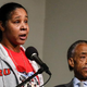 Eric Garner's widow Esaw Garner speaks at a press conference next to the Rev. Al Sharpton at the National Action Network in Harlem on Dec. 6, 2014.
Kena Betancur/Getty Images